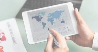Professional using a tablet with stylus, symbolizing digital transformation and innovation in specialty chemicals and business solutions