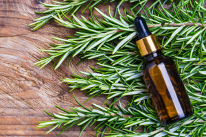 Natural oils and botanical extracts in glass dropper bottle, symbolizing cosmetic emulsifiers in B2B specialty chemicals