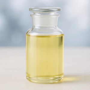 Yellow liquid chemical product in clear glass container