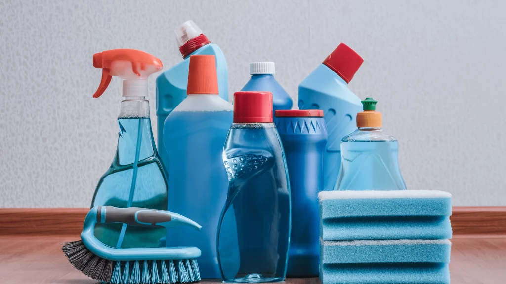 Collection of cleaning products with bottles, sponges, and brushes, representing hygiene and cleaning solutions from SBR International GmbH