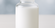 White liquid chemical sample in glass bottle