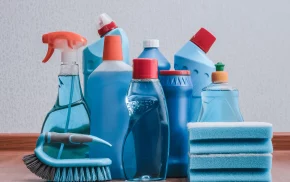 Collection of cleaning products with bottles, sponges, and brushes, representing hygiene and cleaning solutions from SBR International GmbH