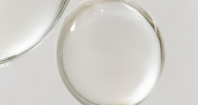 White mineral oil in glass dishes, symbolizing specialty chemicals, purity, and industrial applications